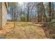 Side view of backyard showing the size and view of the wooded area at 375 Wellington Mill Rd, Whitesburg, GA 30185