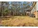 Expansive backyard with mature trees and a storage shed at 375 Wellington Mill Rd, Whitesburg, GA 30185