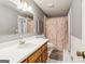 Bathroom featuring a white vanity, seashell shower curtain, and white tile floor at 375 Wellington Mill Rd, Whitesburg, GA 30185