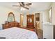 Bedroom featuring neutral carpet, a bed, and adjacent bathroom access at 375 Wellington Mill Rd, Whitesburg, GA 30185