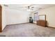 Large bedroom with neutral carpet, a ceiling fan, and two dressers at 375 Wellington Mill Rd, Whitesburg, GA 30185