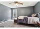 Bedroom with gray walls features a ceiling fan and a window that provides plenty of natural light at 375 Wellington Mill Rd, Whitesburg, GA 30185