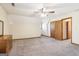Spacious bedroom featuring neutral carpet and a ceiling fan at 375 Wellington Mill Rd, Whitesburg, GA 30185