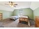 Bedroom with two beds, featuring carpet, a ceiling fan, and a window at 375 Wellington Mill Rd, Whitesburg, GA 30185