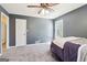 Bedroom features a large closet and window with gray walls and a ceiling fan at 375 Wellington Mill Rd, Whitesburg, GA 30185