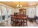 Elegant dining room with hardwood floors, wood ceiling, and chandelier lighting at 375 Wellington Mill Rd, Whitesburg, GA 30185