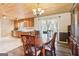 Charming dining room with wood floors, dining table, and adjacent kitchen space at 375 Wellington Mill Rd, Whitesburg, GA 30185