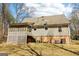 View of the exterior of the home with a screened in porch and a partial view of the yard at 375 Wellington Mill Rd, Whitesburg, GA 30185