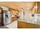 Charming kitchen with wooden cabinets, stainless steel appliances, and beautiful granite countertops at 375 Wellington Mill Rd, Whitesburg, GA 30185