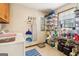 Functional laundry room with ample shelving for storage and natural light from the window at 375 Wellington Mill Rd, Whitesburg, GA 30185