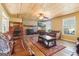 Spacious living room features wood plank ceiling, stone fireplace and comfortable seating area at 375 Wellington Mill Rd, Whitesburg, GA 30185