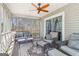 Sunroom features neutral furniture, screened windows and a ceiling fan at 375 Wellington Mill Rd, Whitesburg, GA 30185