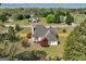 Aerial view of a house with a deck and large backyard surrounded by mature trees at 720 Strawflower Ln, Locust Grove, GA 30248