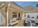 Back porch with outdoor seating, swing, and dining table at 720 Strawflower Ln, Locust Grove, GA 30248