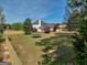 Expansive backyard with trampoline and wood fence at 720 Strawflower Ln, Locust Grove, GA 30248