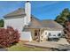 Backyard featuring a spacious deck with outdoor seating and a lush lawn, all within a private and serene setting at 720 Strawflower Ln, Locust Grove, GA 30248