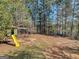Backyard play area with treehouse and slide at 720 Strawflower Ln, Locust Grove, GA 30248
