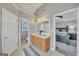 Bright bathroom with double vanity, neutral color scheme, and doorway to main bedroom at 720 Strawflower Ln, Locust Grove, GA 30248