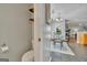Breakfast nook with glass top table, open to kitchen and living area with fireplace at 720 Strawflower Ln, Locust Grove, GA 30248