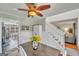 Cozy dining room featuring white wainscoting, hardwood floors, and modern decor at 720 Strawflower Ln, Locust Grove, GA 30248