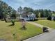 Charming two-story home with a well-manicured lawn, complemented by mature trees and a picturesque fenced-in yard at 720 Strawflower Ln, Locust Grove, GA 30248