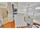 Bright foyer with chandelier, large window, hardwood stairs, and views into other rooms at 720 Strawflower Ln, Locust Grove, GA 30248