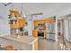 Modern kitchen with stainless steel appliances, light wood cabinets and a peninsula counter with seating at 720 Strawflower Ln, Locust Grove, GA 30248