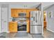 Updated eat-in kitchen showcases stainless appliances and plenty of cabinet space at 720 Strawflower Ln, Locust Grove, GA 30248