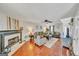 Bright living room with a fireplace, hardwood flooring, and stylish decor at 720 Strawflower Ln, Locust Grove, GA 30248