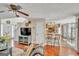 Open-concept living room with hardwood floors and open kitchen access, perfect for entertaining at 720 Strawflower Ln, Locust Grove, GA 30248