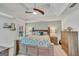 Generously sized main bedroom with ceiling fan, natural light, and neutral tones at 720 Strawflower Ln, Locust Grove, GA 30248