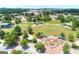 Aerial view showcases the community park's landscaped areas, a fountain, and open green spaces at 768 Scales Rd, Suwanee, GA 30024
