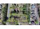 Aerial view of a wooded homesite in a residential community, surrounded by trees and established homes at 768 Scales Rd, Suwanee, GA 30024