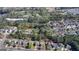 An aerial view shows the lot location within a lush, wooded neighborhood at 768 Scales Rd, Suwanee, GA 30024