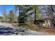 Exterior view of a small, older home with a covered porch at 768 Scales Rd, Suwanee, GA 30024