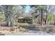 Charming single-story house featuring a cozy front porch and mature trees at 768 Scales Rd, Suwanee, GA 30024