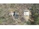 Bird's-eye view of the home, revealing the roofline, surrounding greenery, and outbuildings at 595 S Antioch Rd, Mcdonough, GA 30252