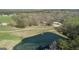 Scenic aerial view showcasing a home by a serene pond surrounded by lush landscapes at 595 S Antioch Rd, Mcdonough, GA 30252