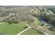 Overhead shot highlighting the property's pond, house and lush greenery offering a peaceful retreat at 595 S Antioch Rd, Mcdonough, GA 30252