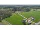 Expansive property featuring lush green pastures, a tranquil pond, and mature trees at 595 S Antioch Rd, Mcdonough, GA 30252
