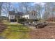 Large backyard with fire pit, patio area, and hot tub at 595 S Antioch Rd, Mcdonough, GA 30252