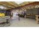 Unfinished basement with concrete floor, wood beams, and ample space for storage or customization at 595 S Antioch Rd, Mcdonough, GA 30252
