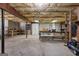 Spacious unfinished basement with exposed beams and ample storage at 595 S Antioch Rd, Mcdonough, GA 30252