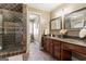 Elegant bathroom featuring a tiled shower and granite countertops at 595 S Antioch Rd, Mcdonough, GA 30252