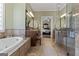 Large primary bath features a glass shower, soaking tub, double vanity, and lots of counter space at 595 S Antioch Rd, Mcdonough, GA 30252
