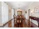 Elegant dining room with hardwood floors, chandelier, and bright natural light at 595 S Antioch Rd, Mcdonough, GA 30252