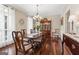 Sophisticated dining room boasting hardwood floors, chandelier, and ample natural light at 595 S Antioch Rd, Mcdonough, GA 30252