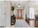 Elegant foyer featuring hardwood floors, decorative mirror and light fixtures creating an inviting entrance at 595 S Antioch Rd, Mcdonough, GA 30252