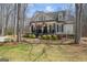 Well-maintained home with a welcoming front porch, black shutters, and attractive landscaping at 595 S Antioch Rd, Mcdonough, GA 30252