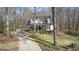 Beautiful home with a long drive, manicured lawn, and a lovely front porch at 595 S Antioch Rd, Mcdonough, GA 30252